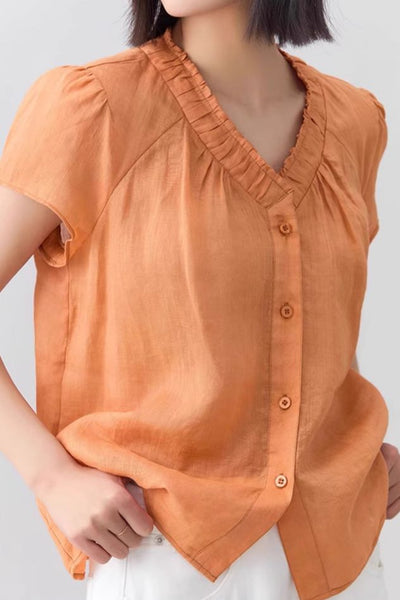 Casual V-neck gathered loose shirt.