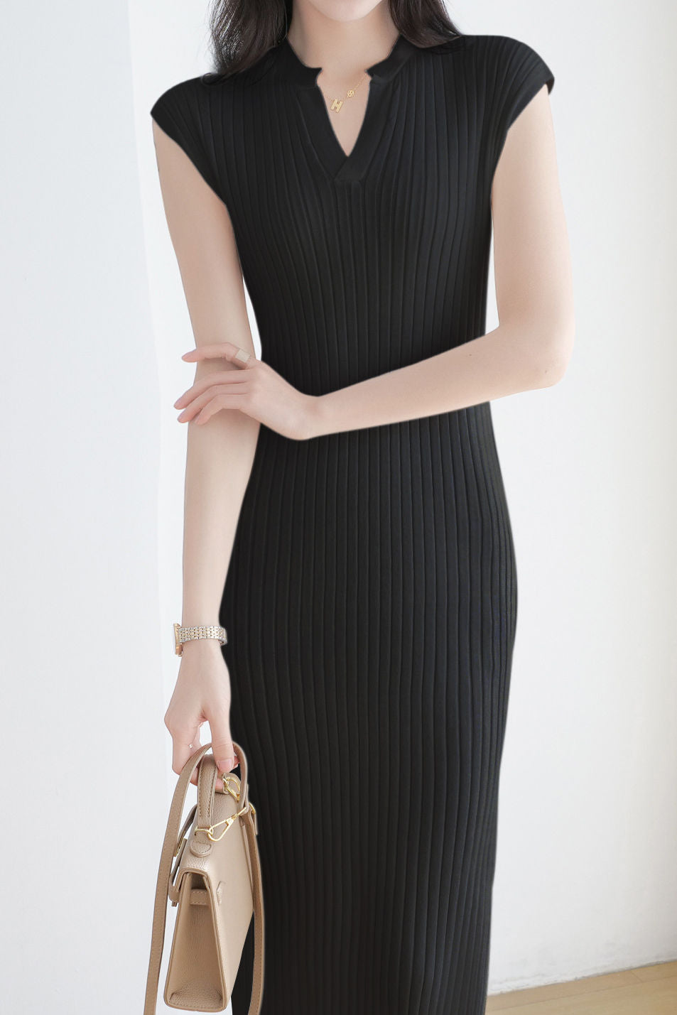 V-neck cap sleeve fitted dress with side slits in ribbed knit